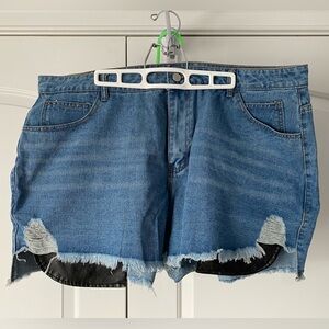 Denim shorts with faux leather pockets